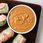 Overhead of peanut sauce in white bowl.