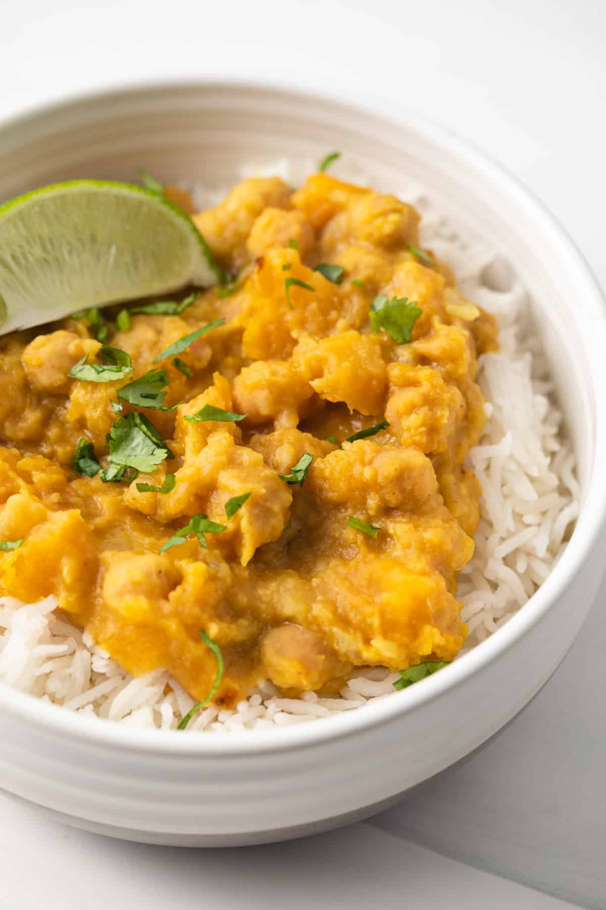Close up of vegan pumpkin curry over rice.