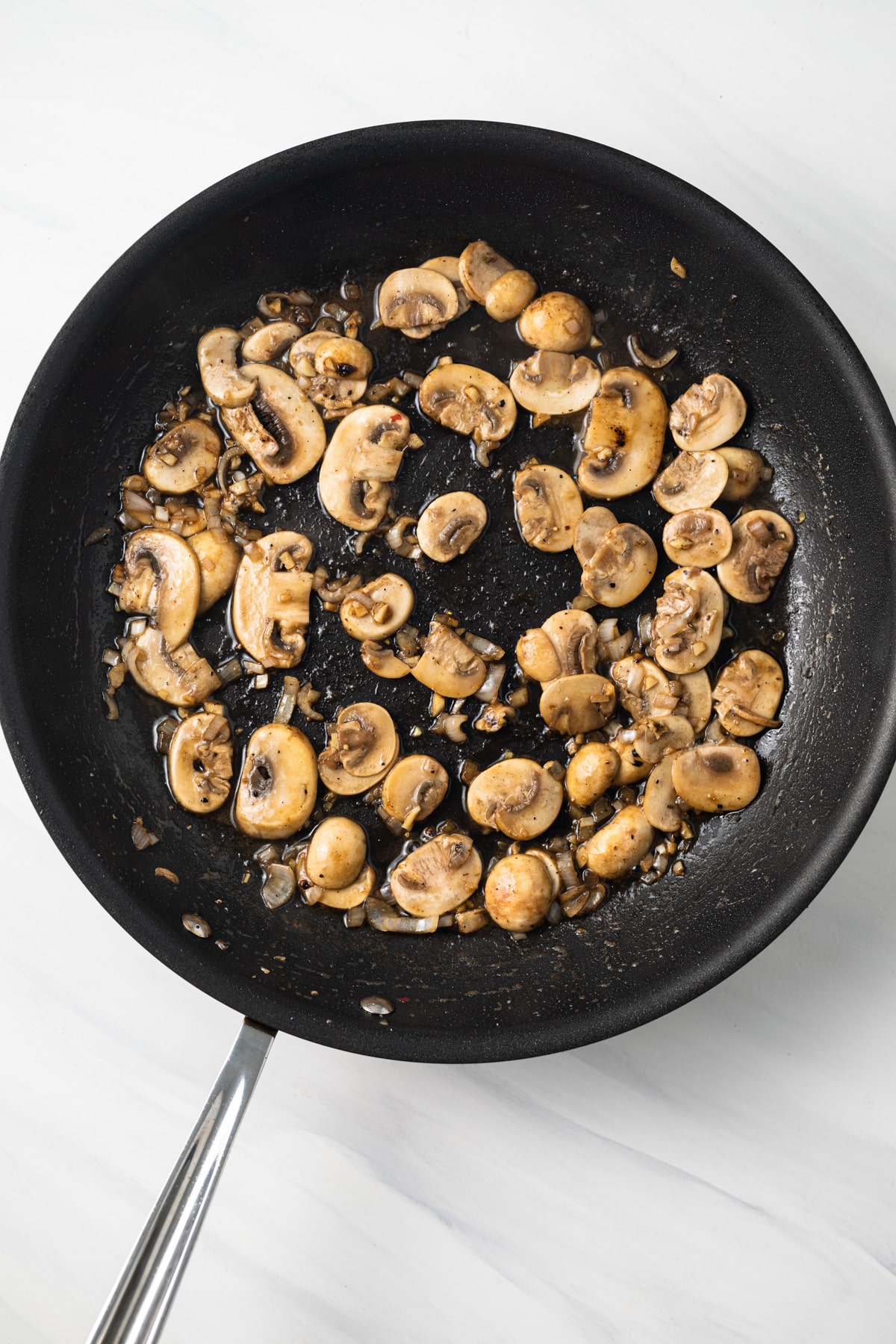 Sauteed mushrooms in a skillet.