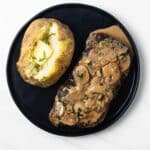 Overhead view of diane sauce over steak.