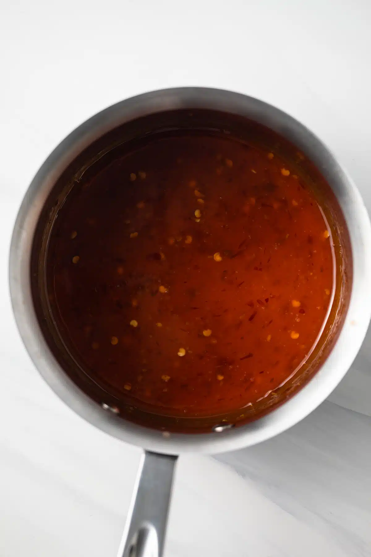 Sweet chili sauce in saucepan.