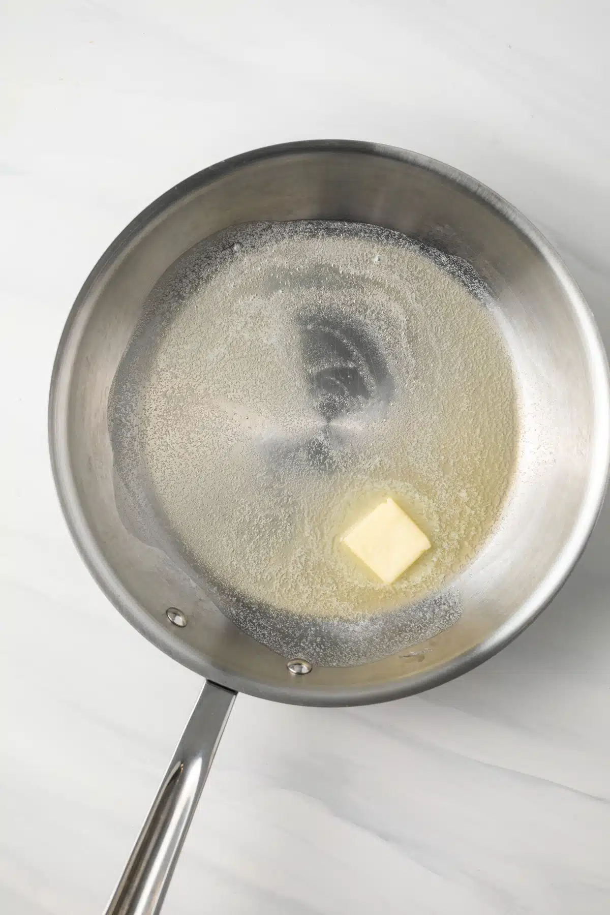 Melted butter in a skillet.