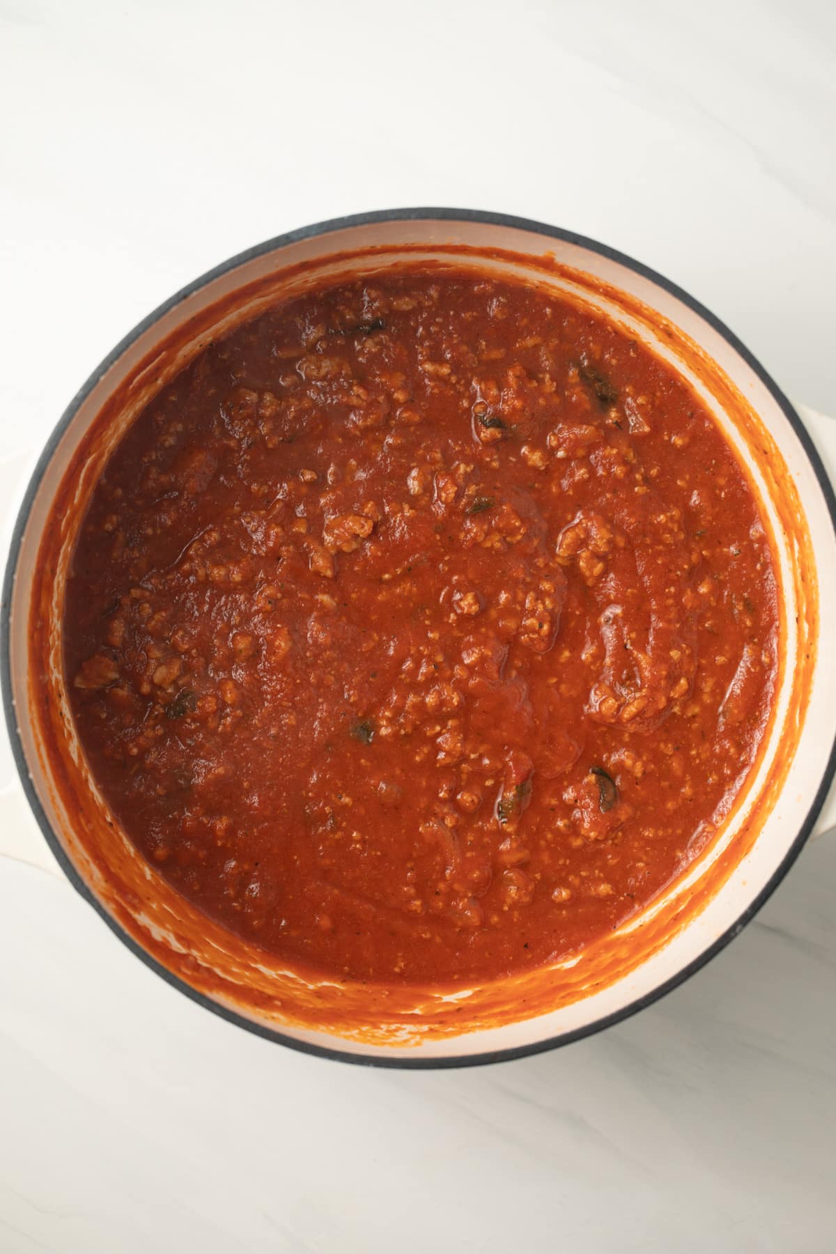 Ground turkey meat sauce in saucepan.
