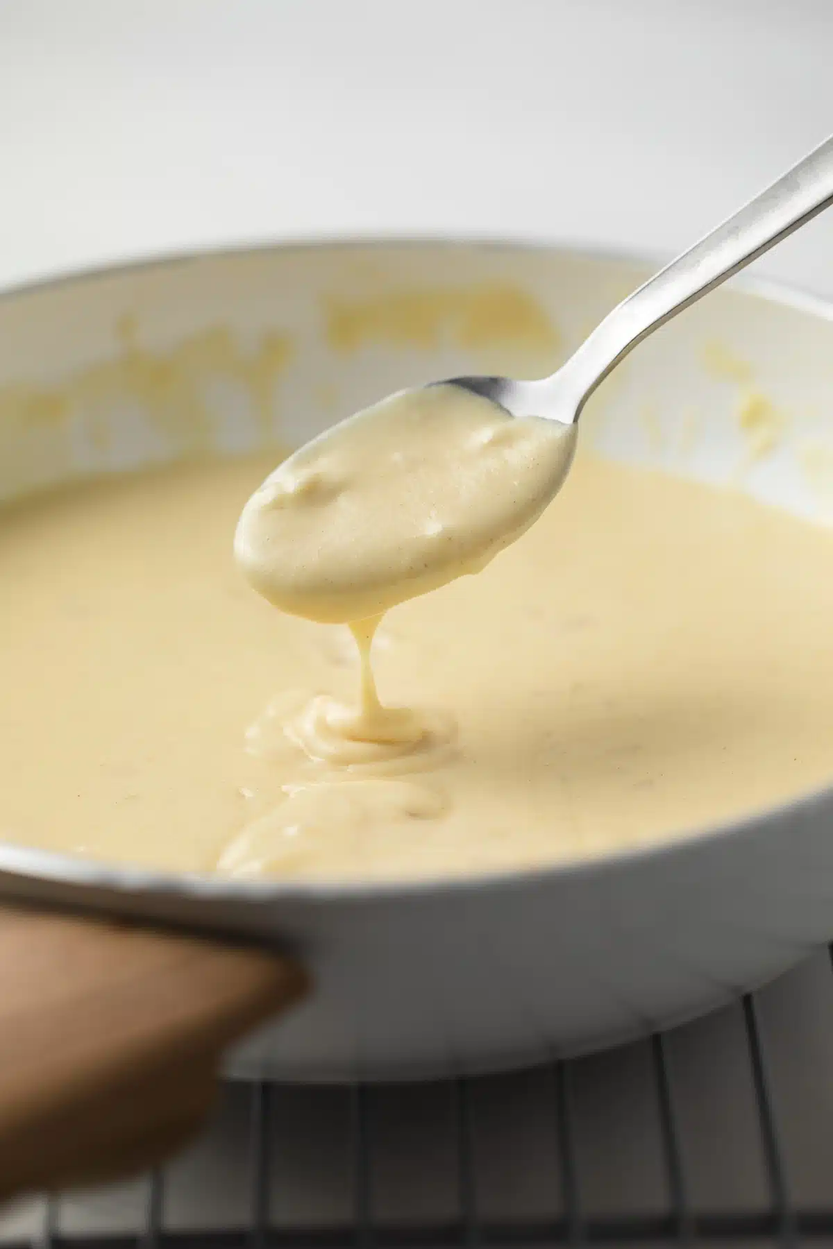 Dijon mustard sauce on a spoon.
