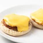 Hollandaise sauce over eggs benedict.