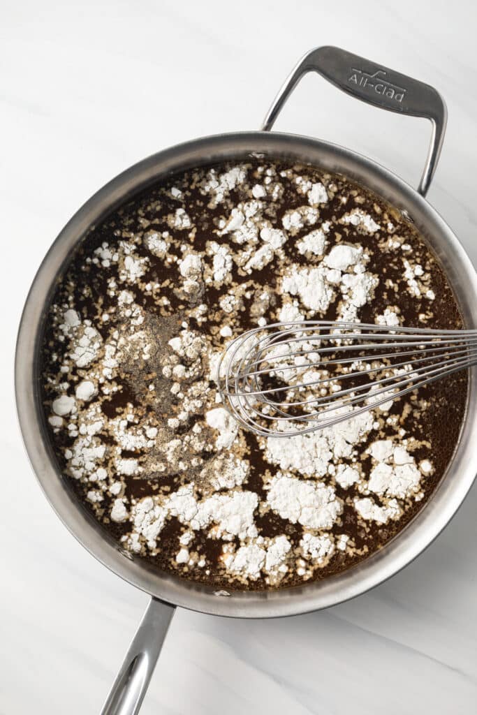 Beef drippings with flour in a skillet.