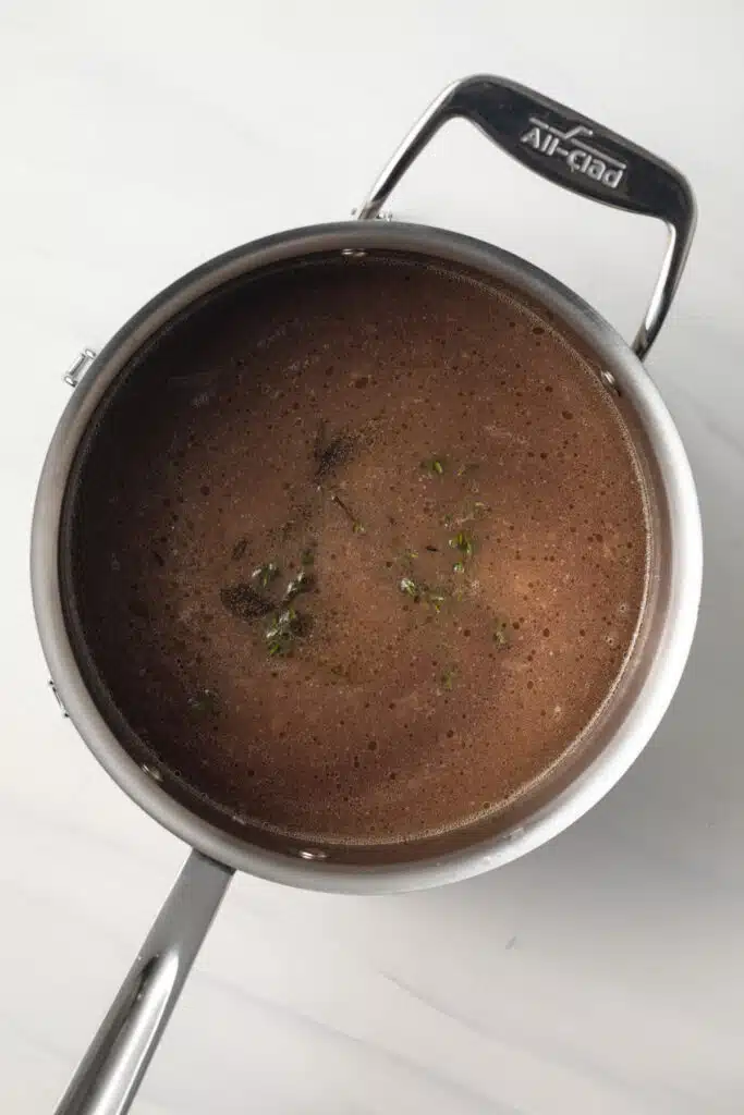 Red wine sauce in saucepan.