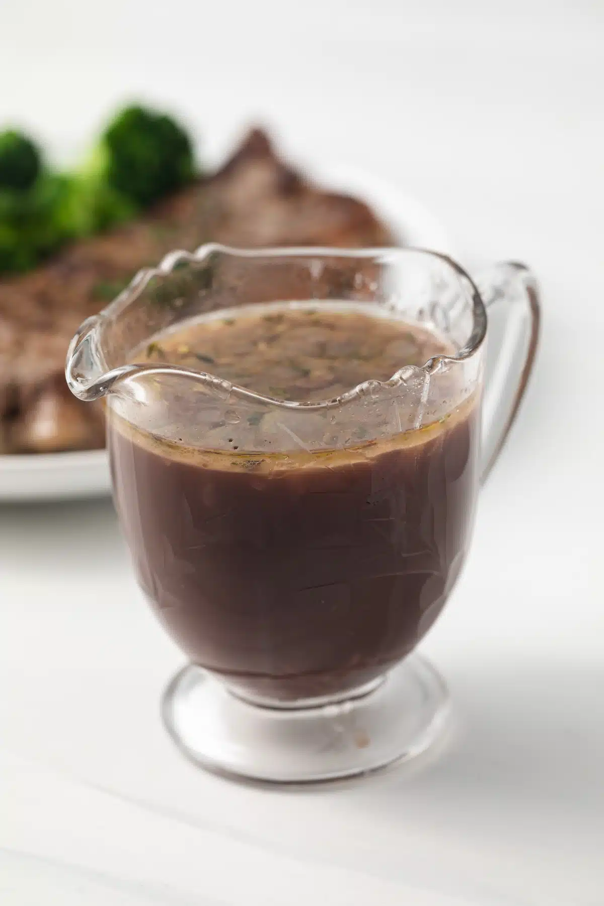 Red wine sauce in glass jar.