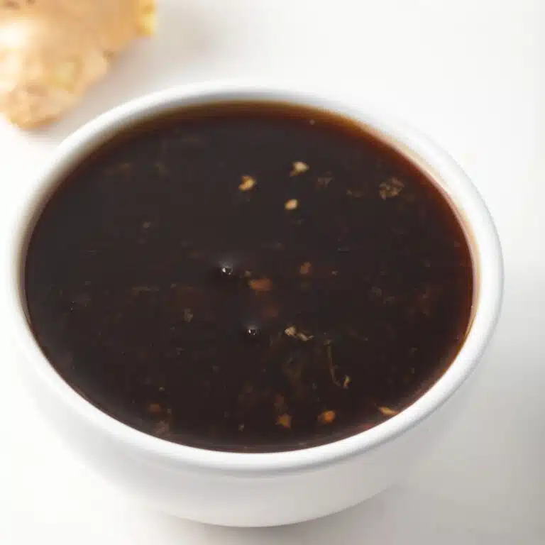 Teriyaki sauce in a white bowl.