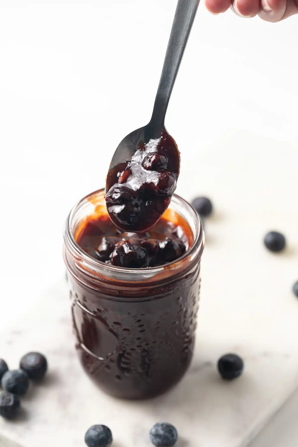 Blueberry BBQ sauce on a spoon.