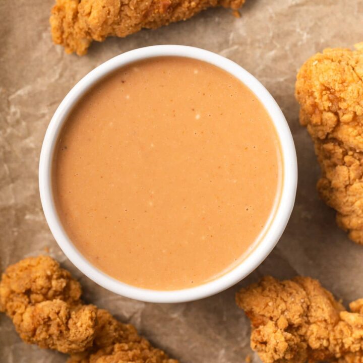 Chicken nugget dipping sauce in white bowl.