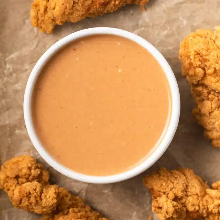Chicken nugget dipping sauce in white bowl.