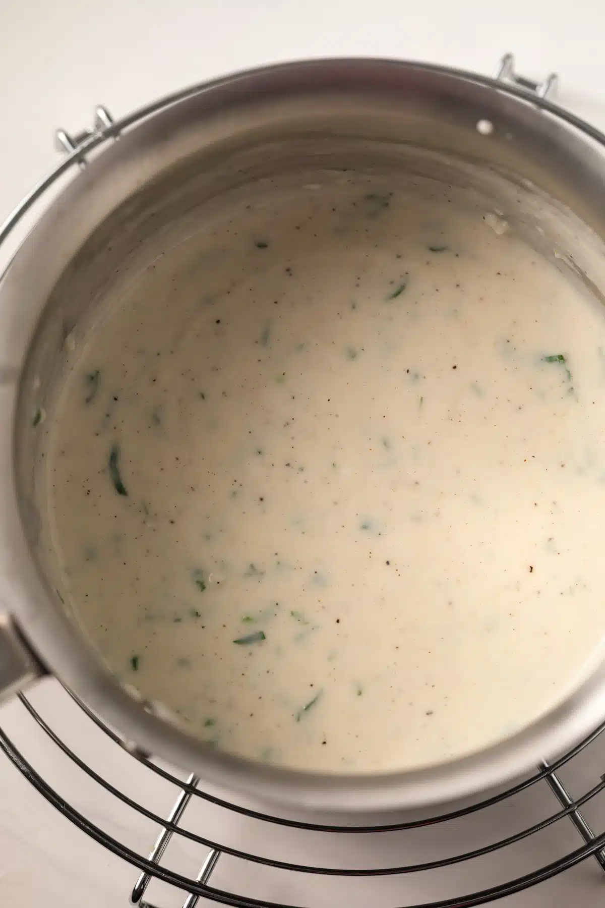 White garlic sauce in a saucepan.