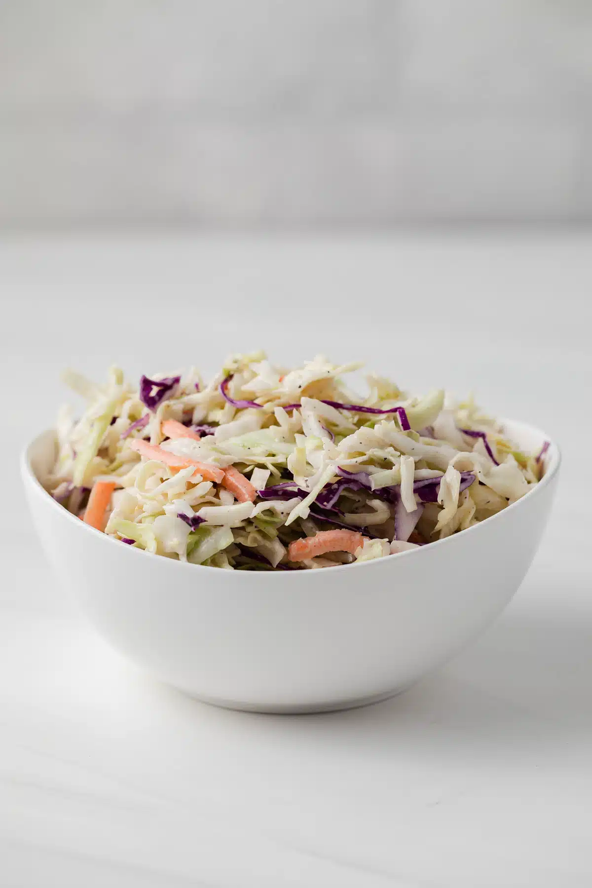 Side view of slaw coated in coleslaw dressing.