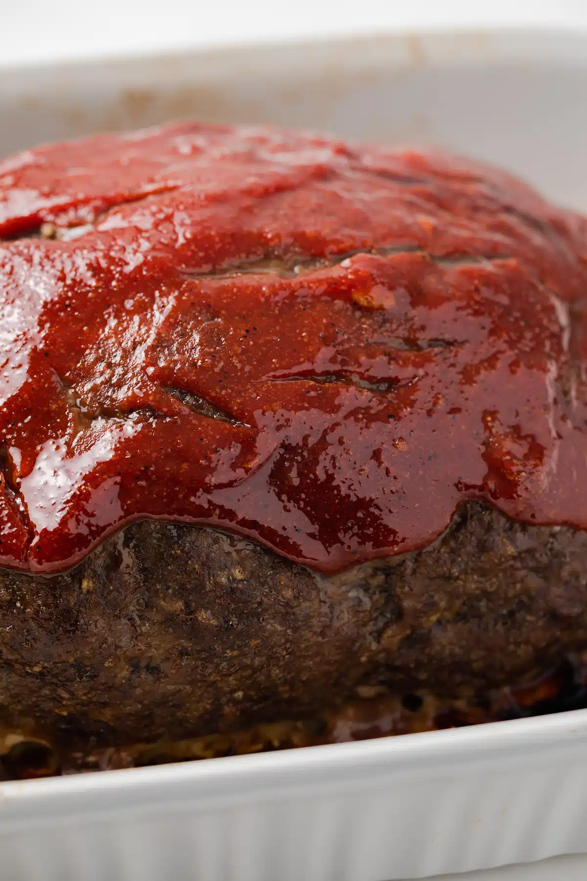 Meatloaf sauce on top of baked meatloaf.
