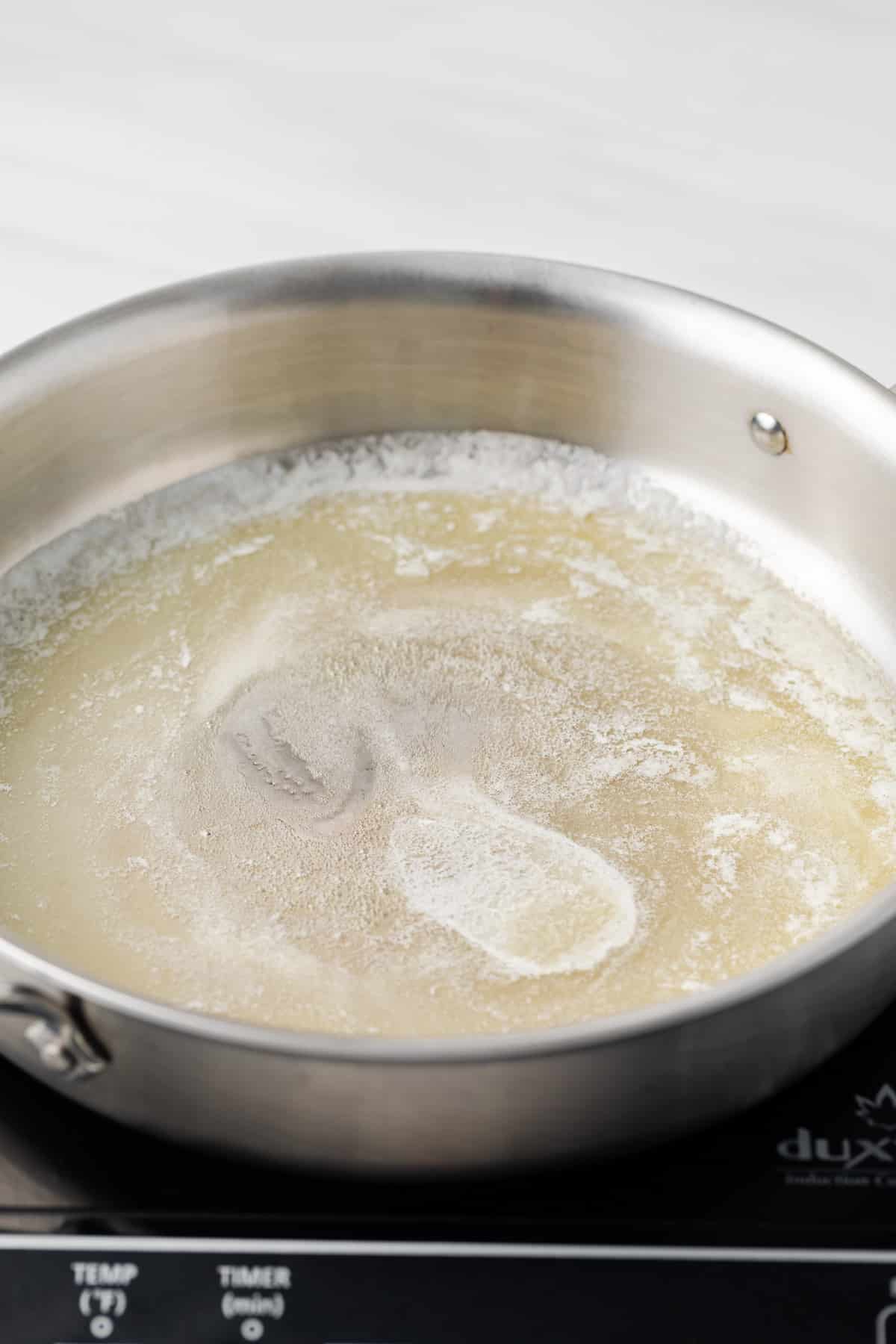 Melted butter in skillet.