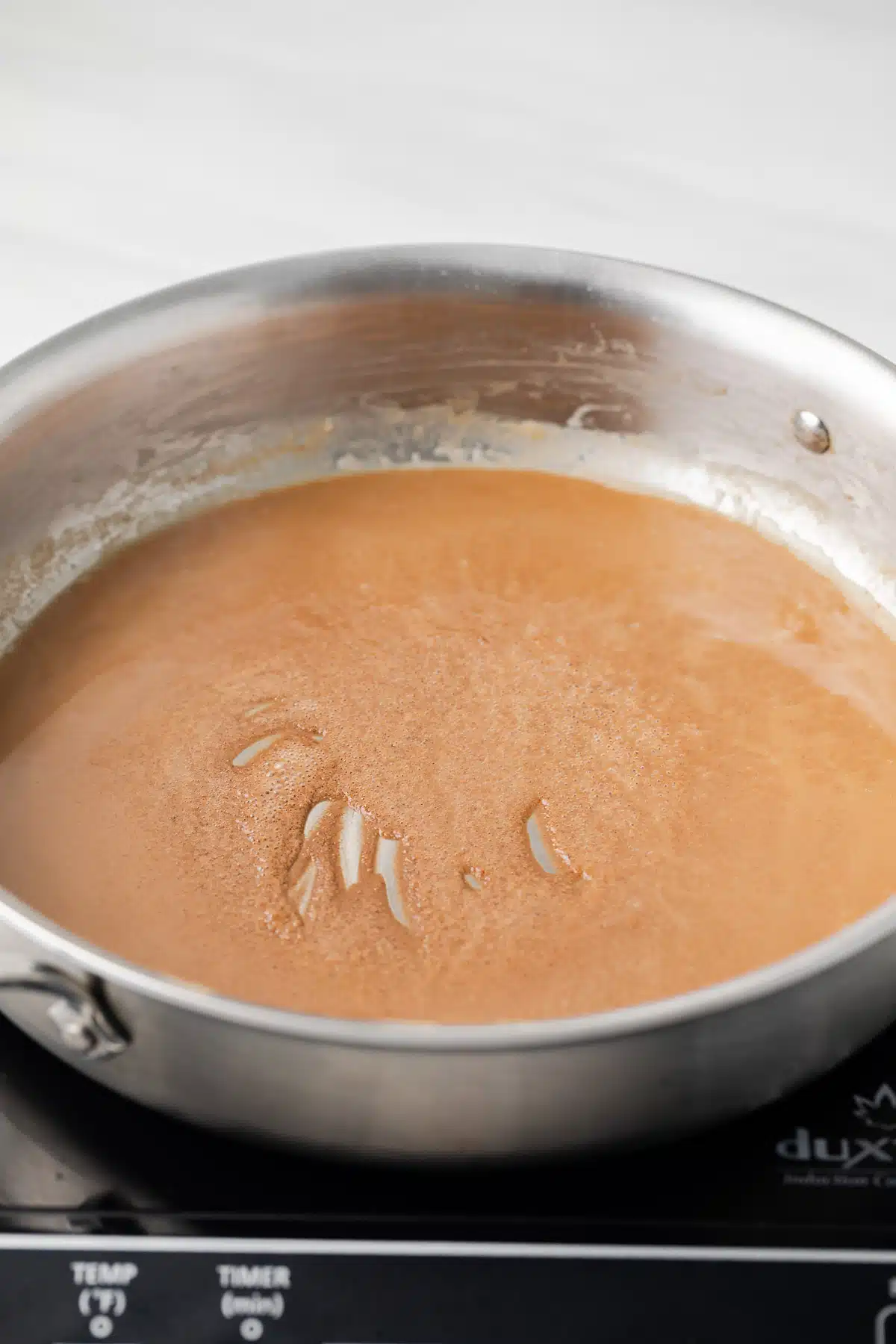 Brown roux in skillet.