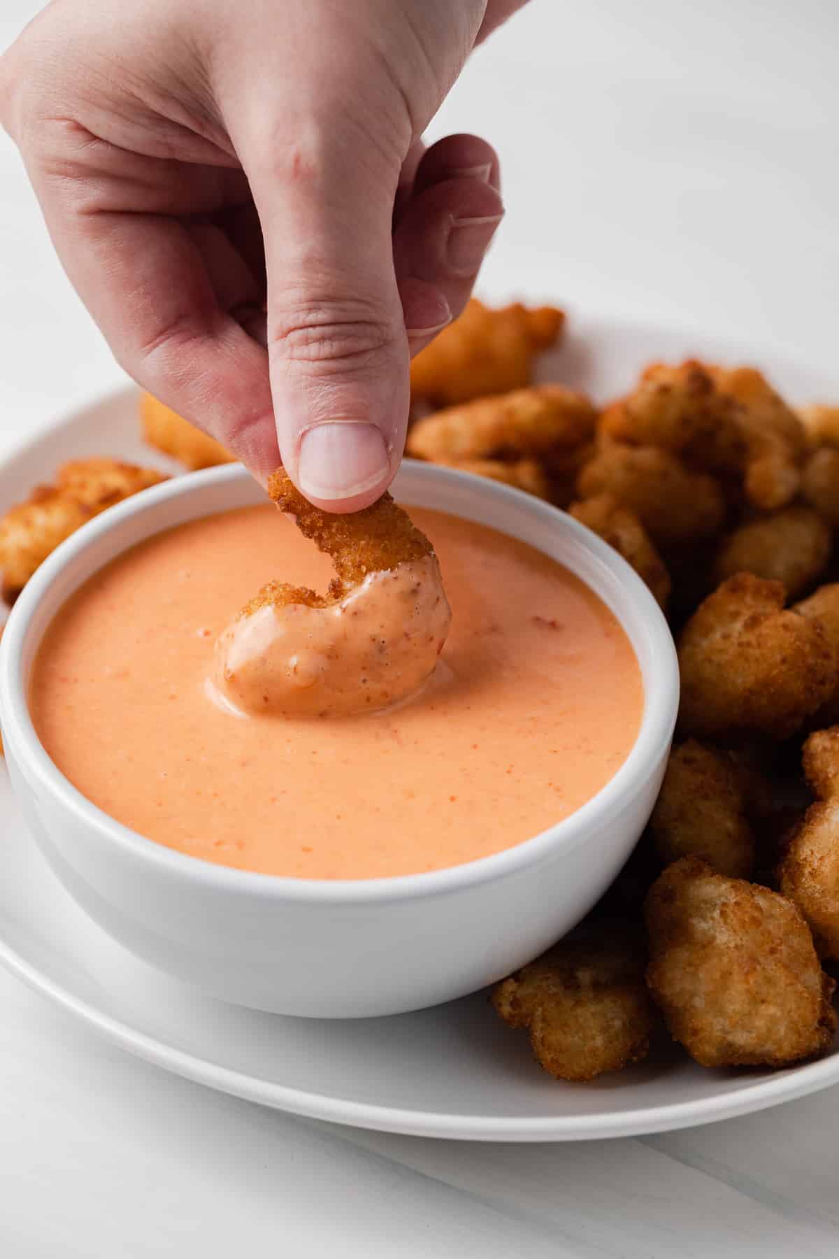 Fried shrimp dipped in bang bang sauce.