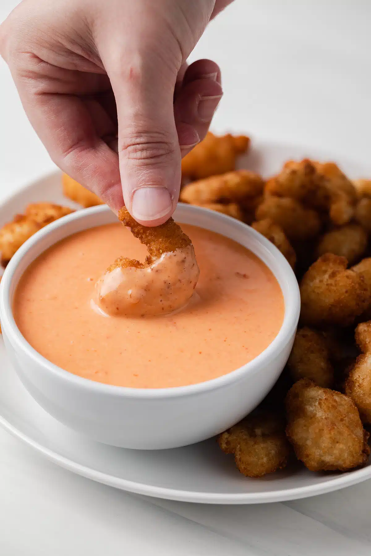 Fried shrimp dipped in bang bang sauce.