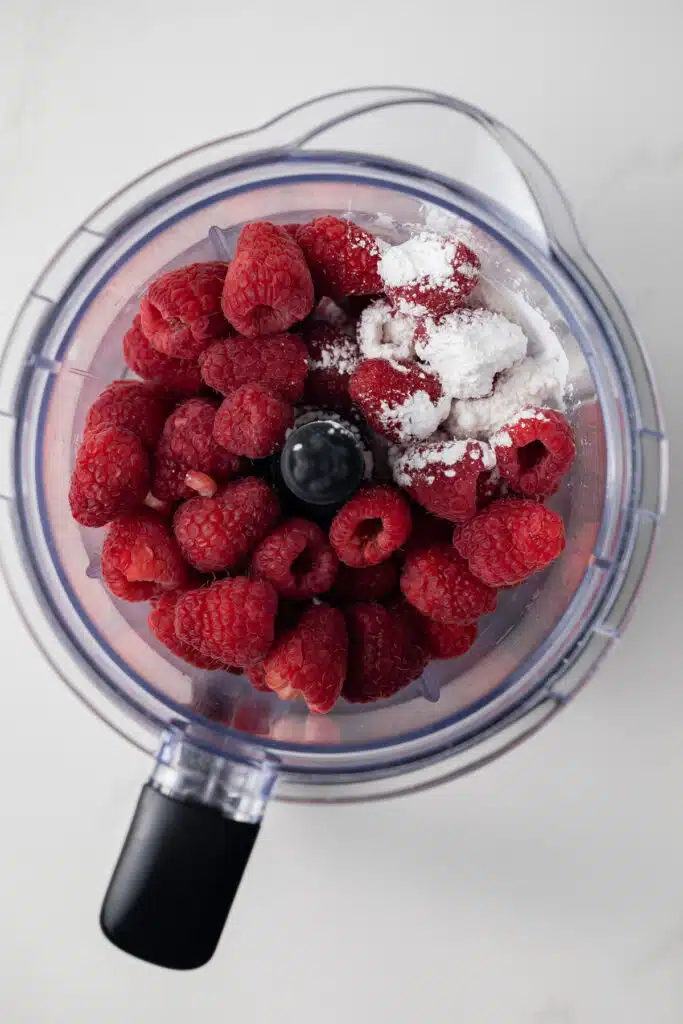 Raspberries and cornstarch in a blender.
