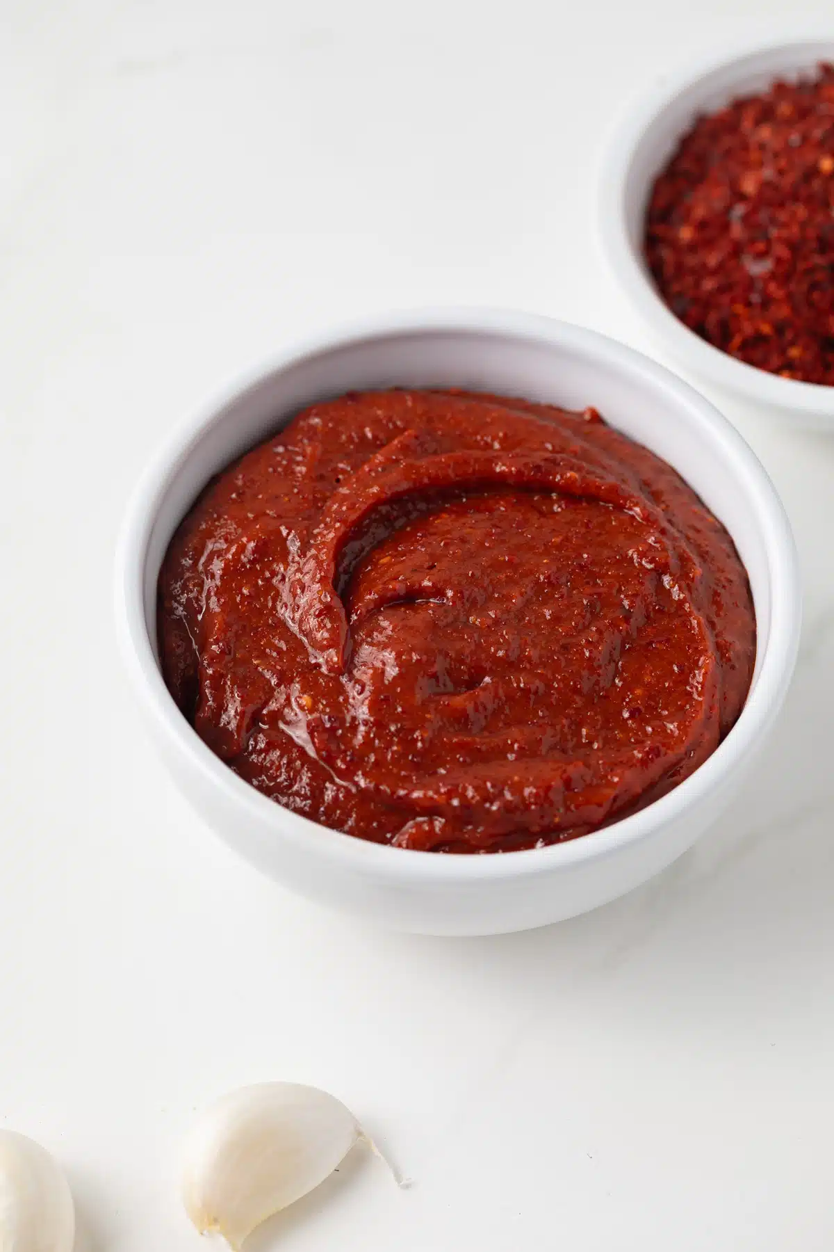 Side view of easy gochujang in white bowl.