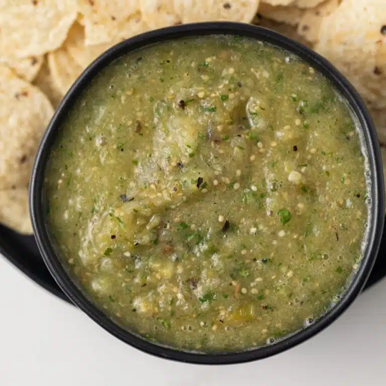 Close up of salsa verde in black bowl.