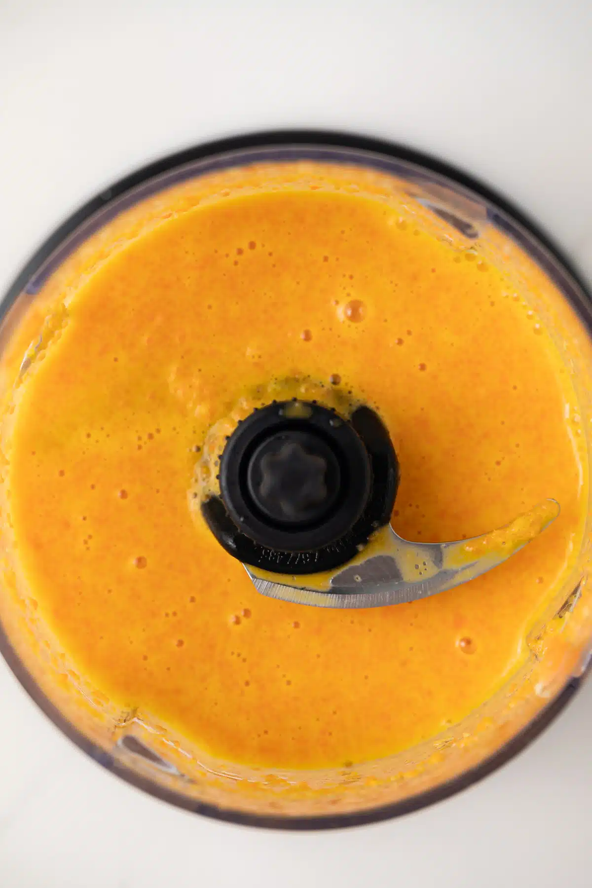 Carrot ginger dressing in food processor.