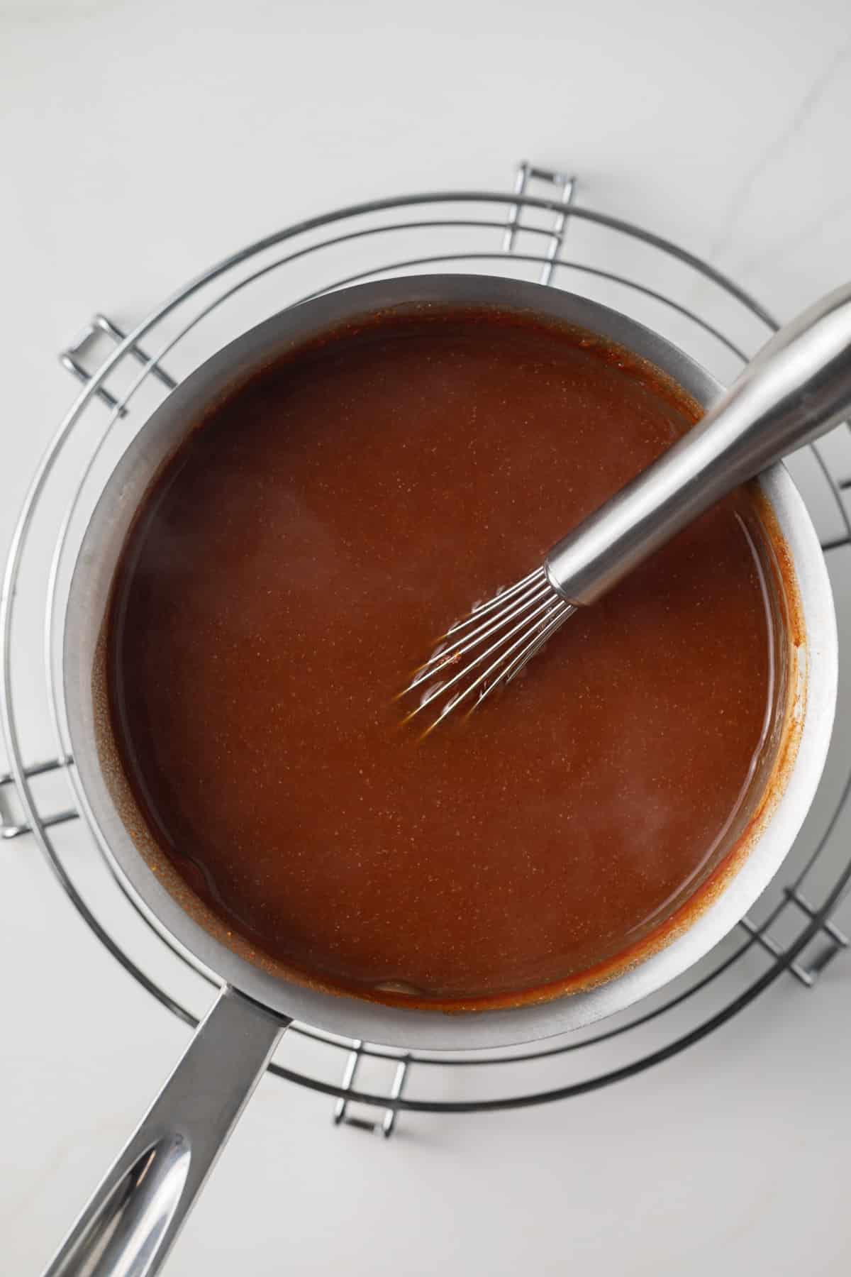 Pineapple orange sauce in a saucepan.