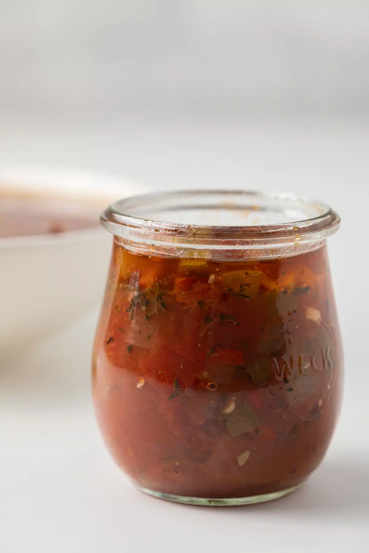Creole sauce in glass jar.