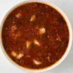 Creole sauce with shrimp in white bowl.