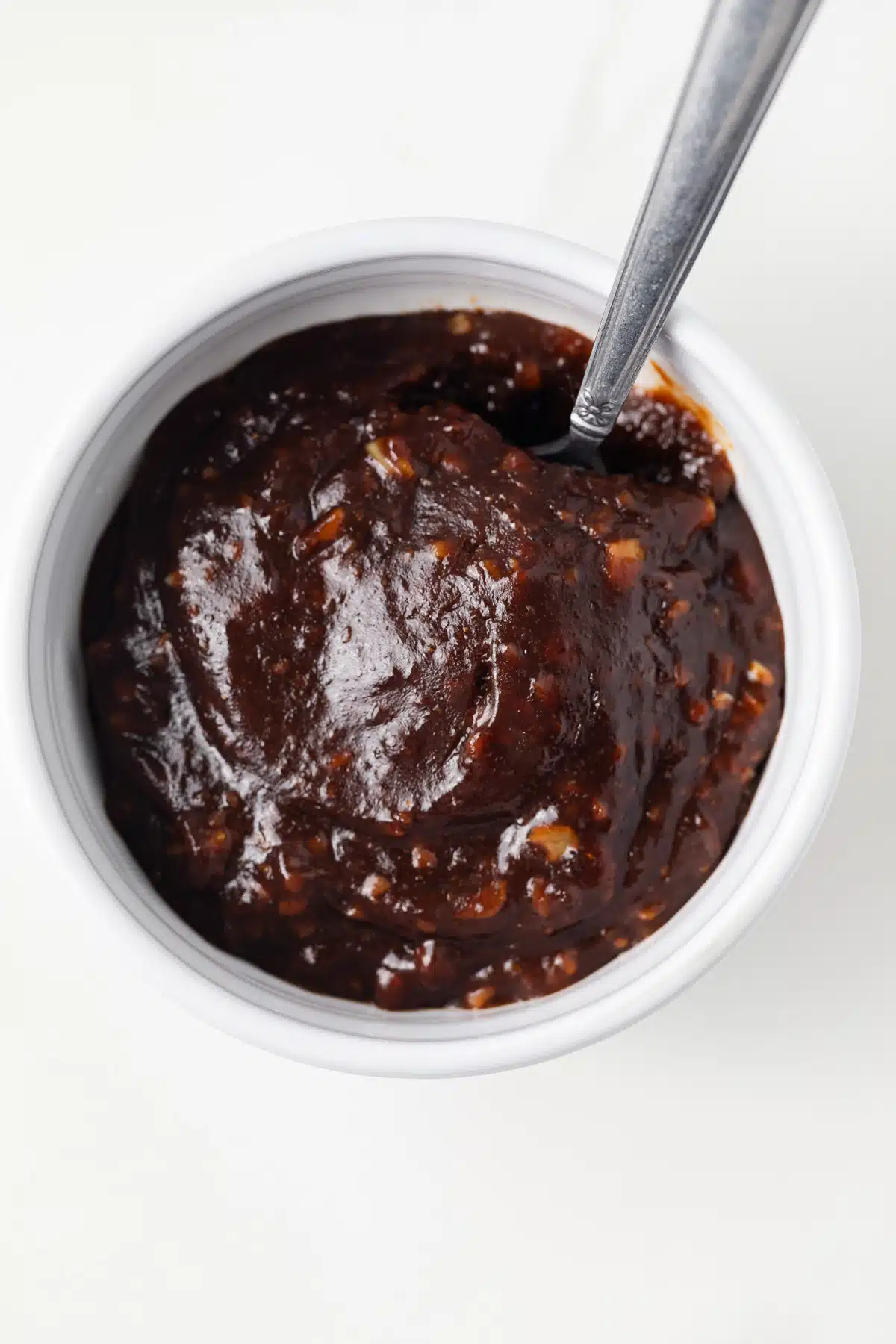 Overhead of hoisin sauce in white bowl.