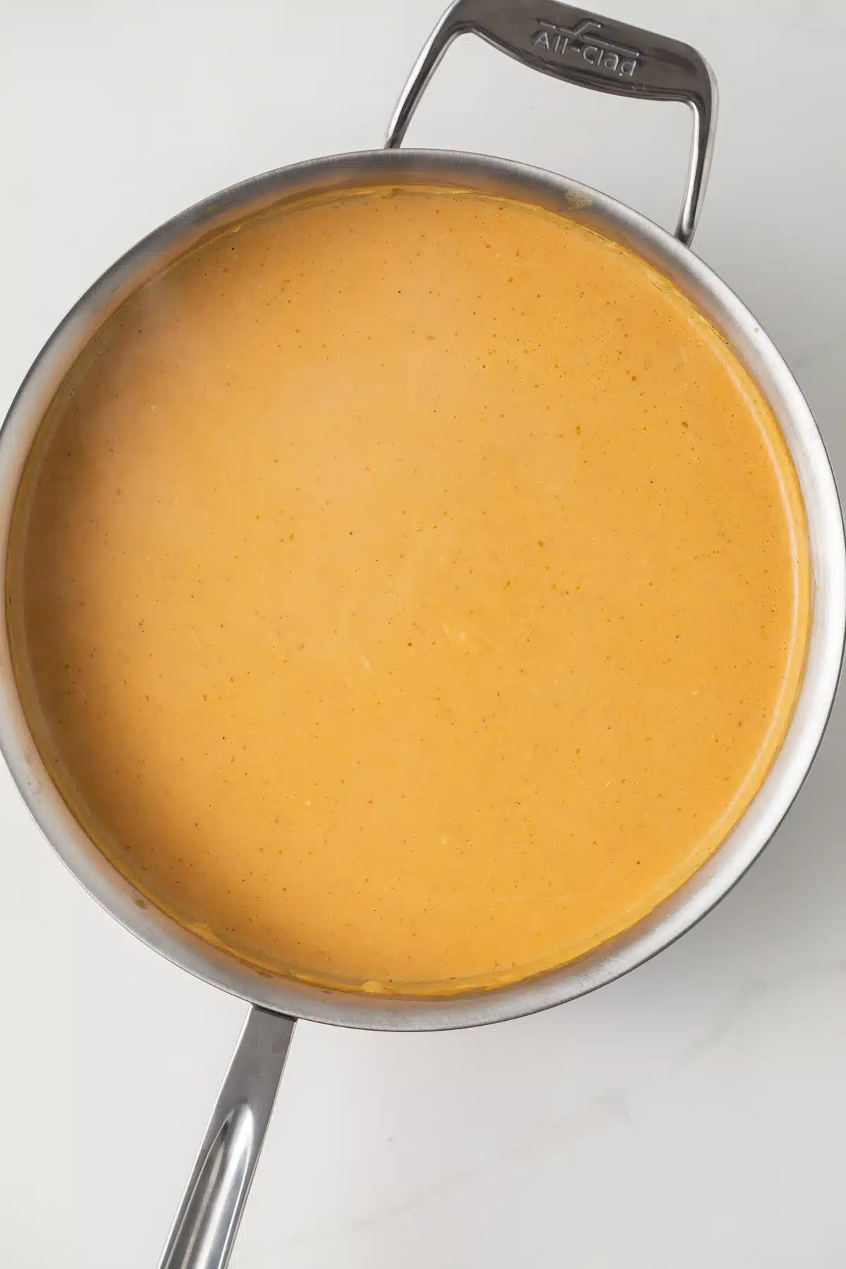 Pumpkin pasta sauce in a skillet.