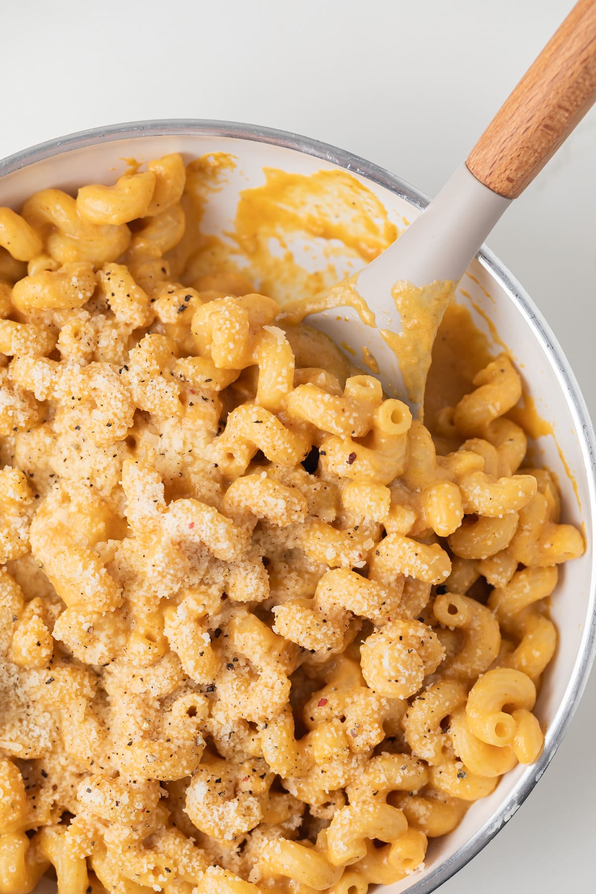 Noodles coated in pumpkin pasta sauce.