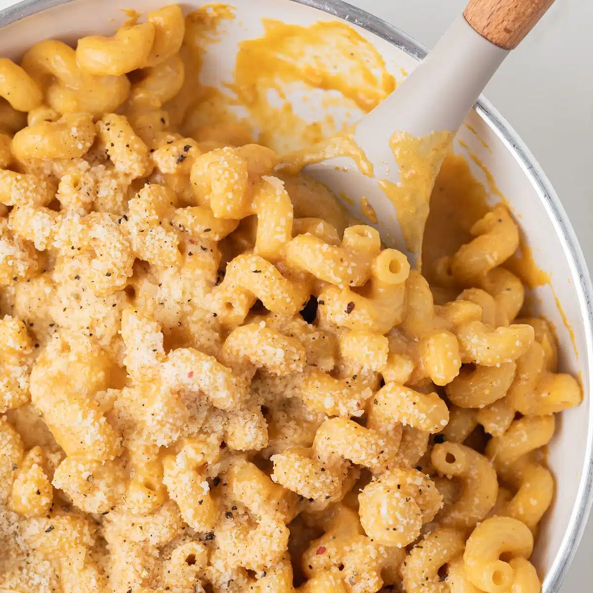 Noodles coated in pumpkin pasta sauce.