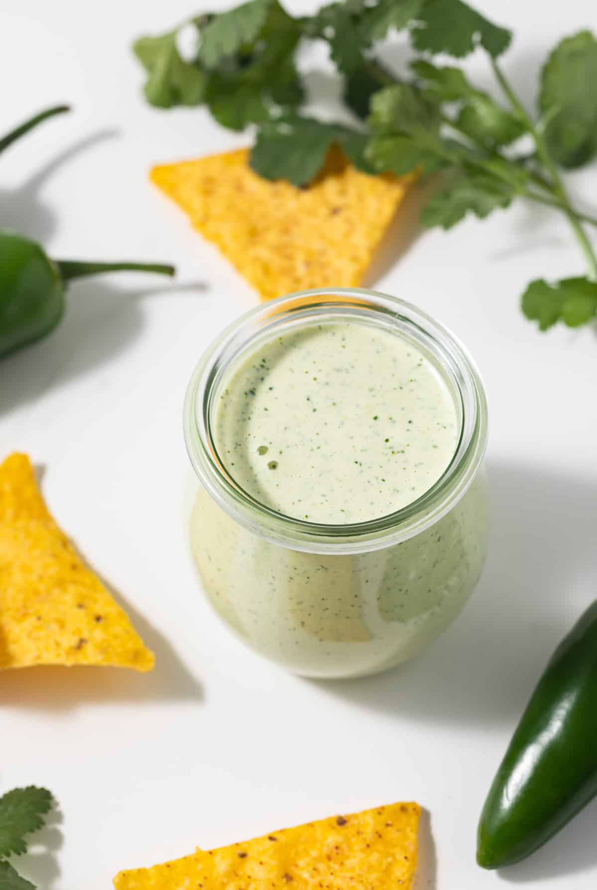 Creamy jalapeno sauce in a glass jar.
