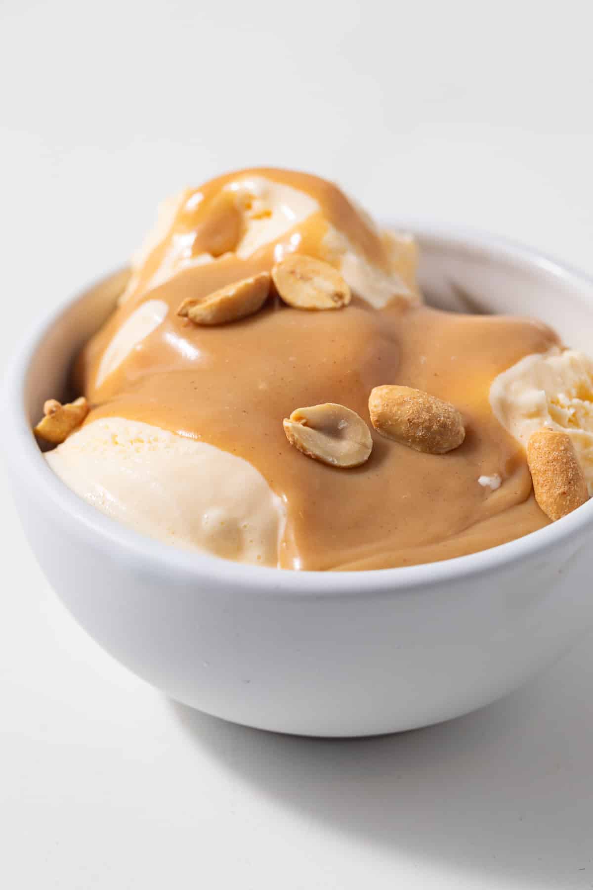 Peanut butter dessert sauce over ice cream.