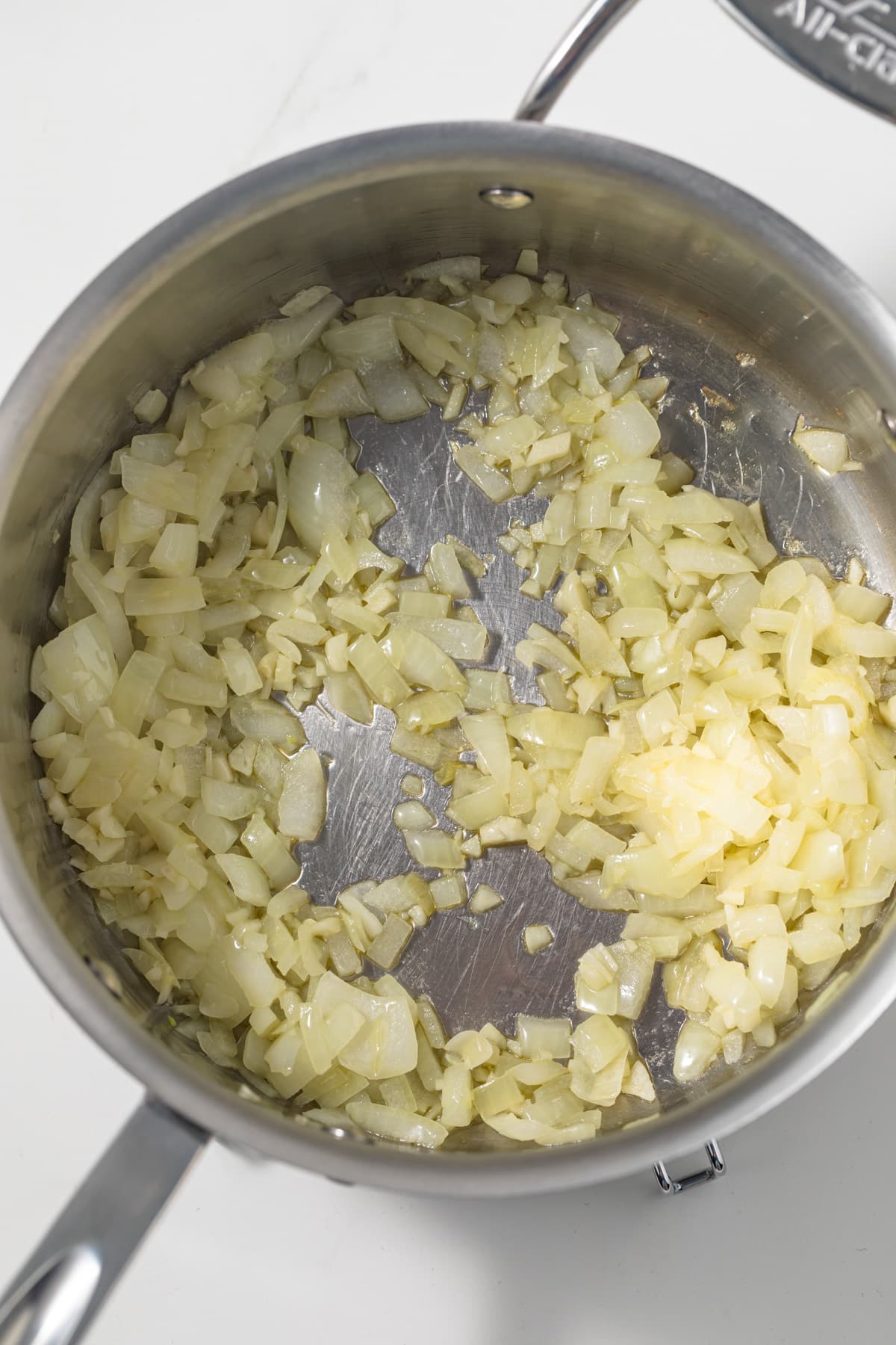 Sauteed onion and garlic in pot.