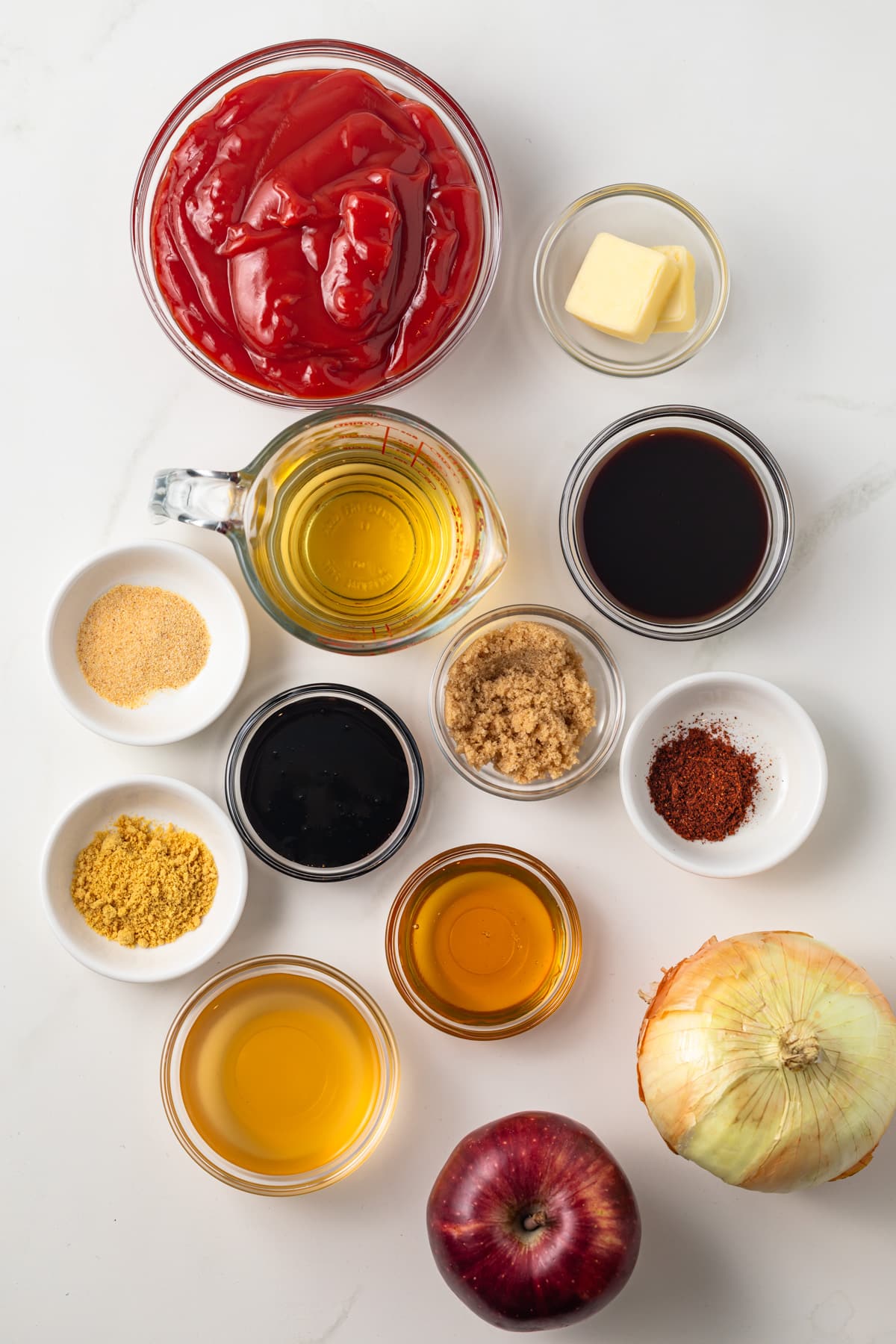 Ingredients for apple barbecue sauce in bowls.