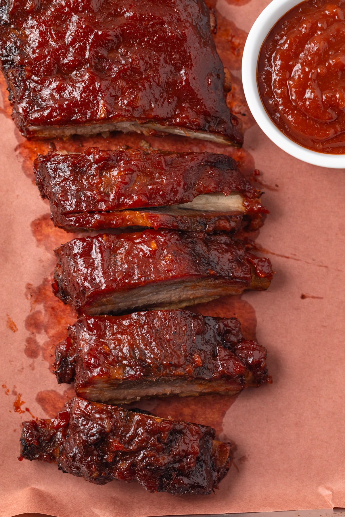 Ribs with a ramekin of apple bbq sauce.