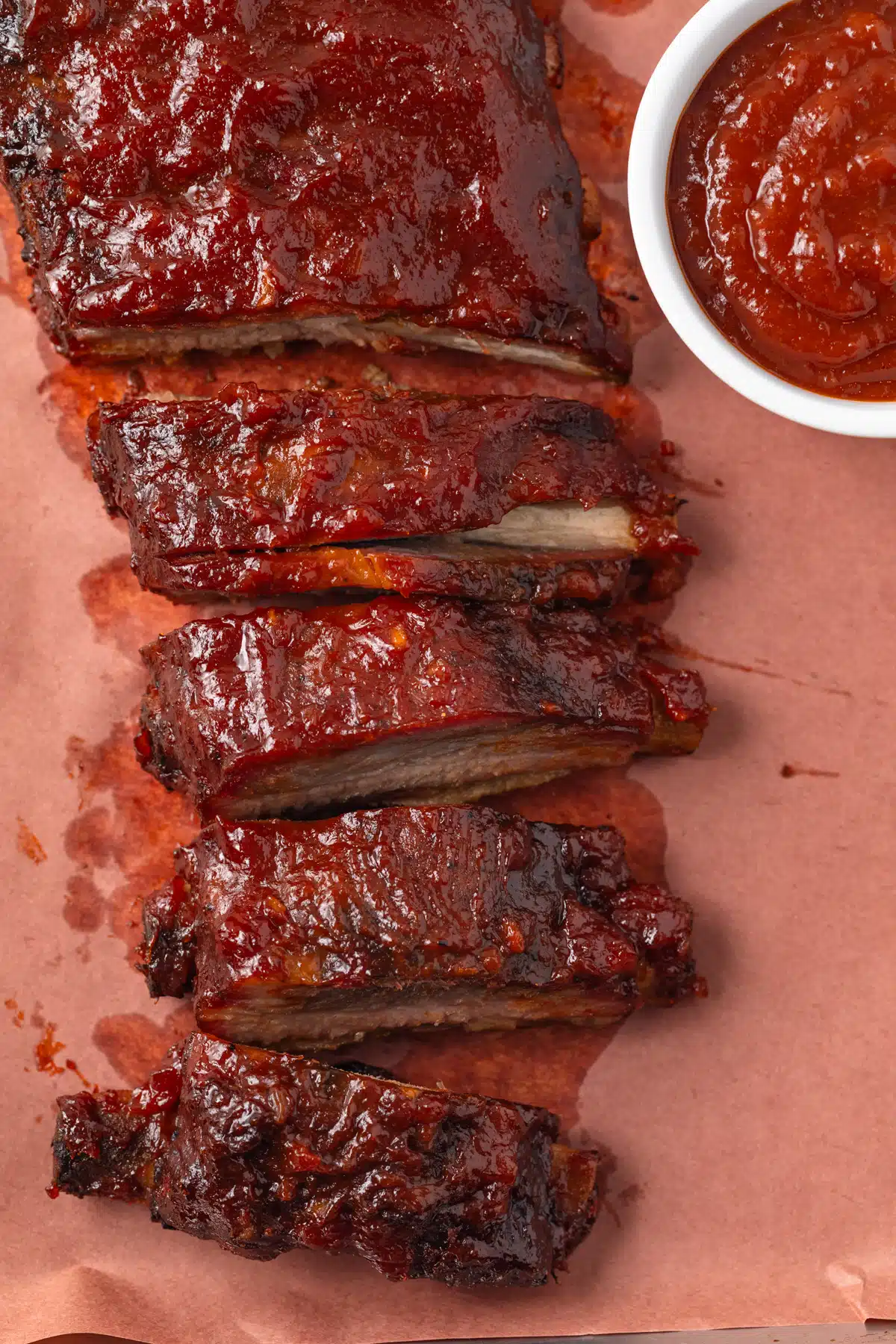 Ribs with a ramekin of apple bbq sauce.