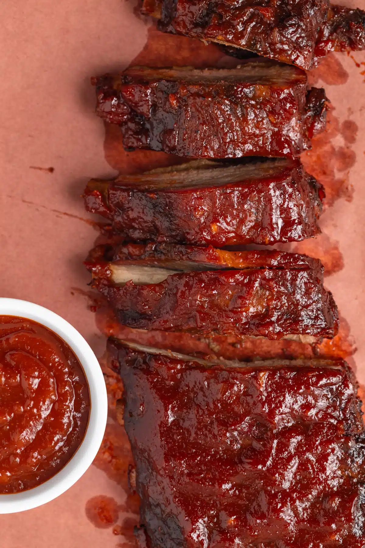 Ribs with a ramekin of apple bbq sauce.