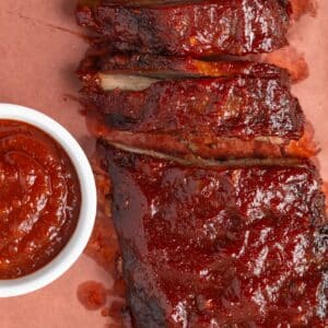 Ribs with a ramekin of apple bbq sauce.