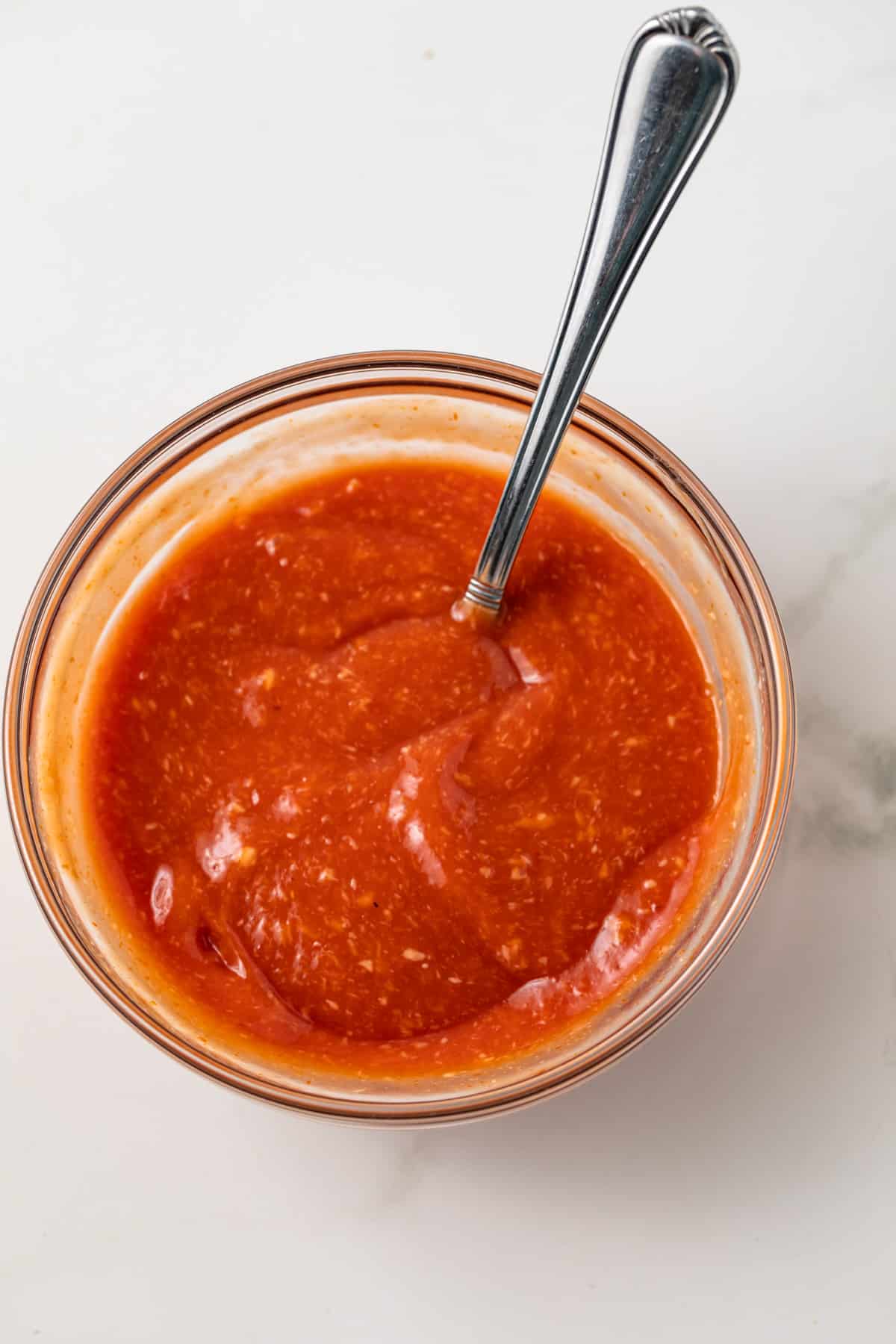 Cocktail sauce in glass bowl.