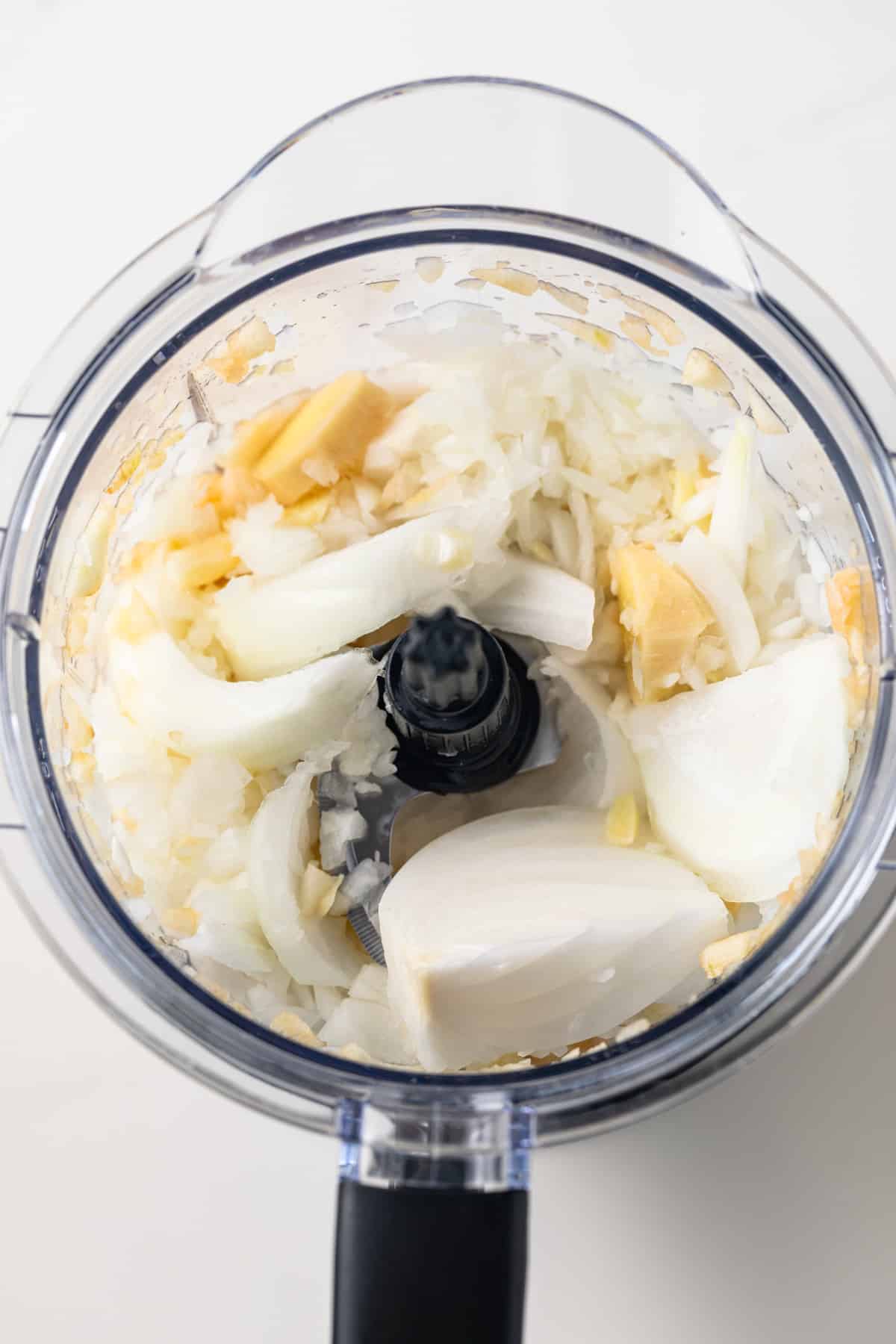 Apples and onions minced in a food processor.