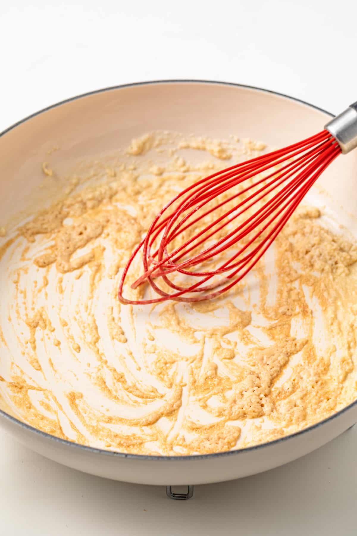 Butter and flour cooked in pan to make roux.