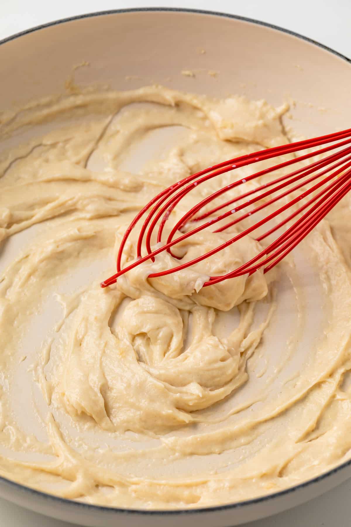 Roux in a pan with whisk.