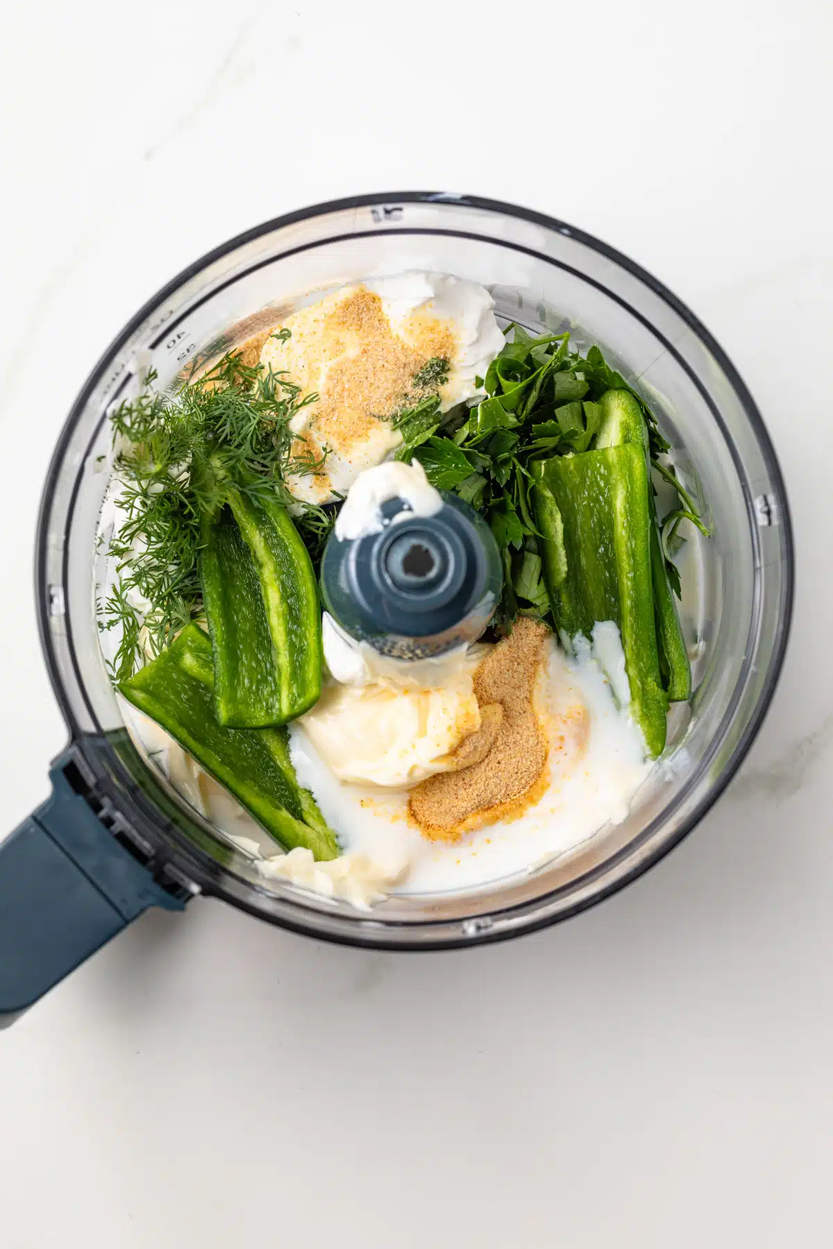 Ingredients for dressing in a food processor.