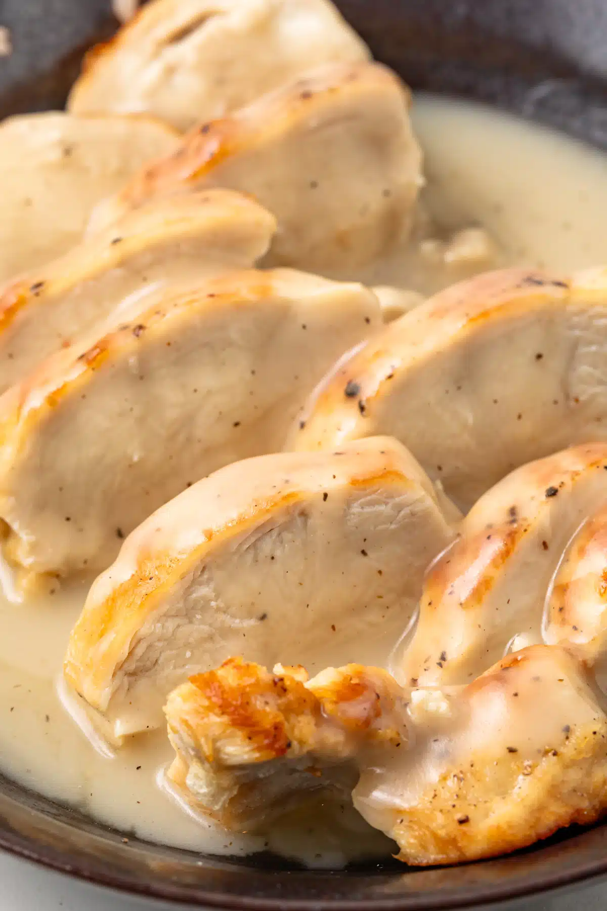 Close up of chicken smothered in gravy.