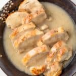 Chicken with chicken gravy in a bowl.