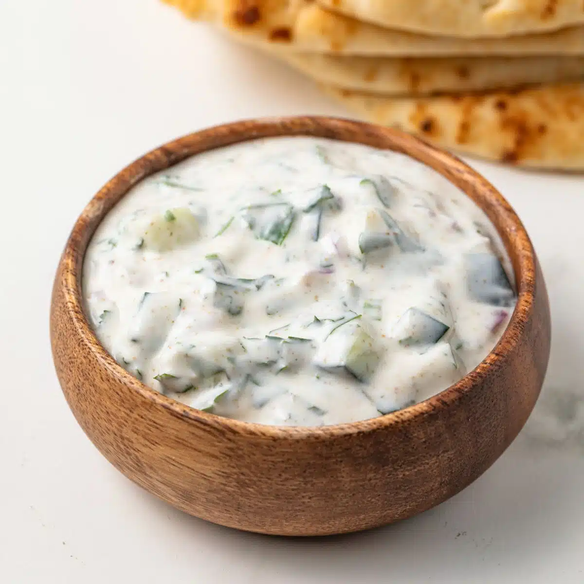 Indian Raita in a brown bowl.